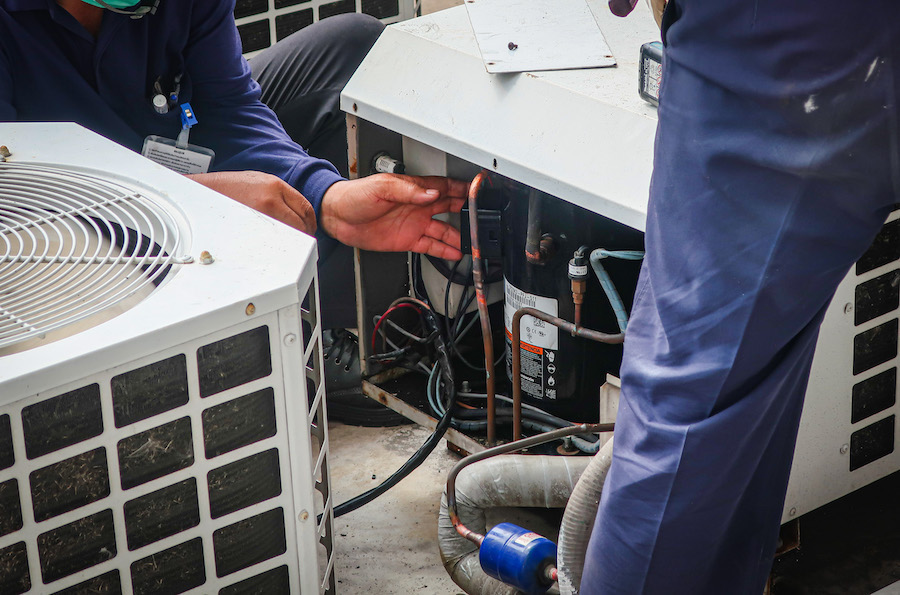HVAC techs servicing AC