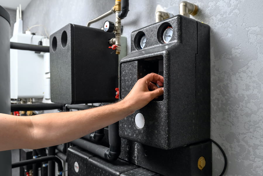 Technician servicing furnace
