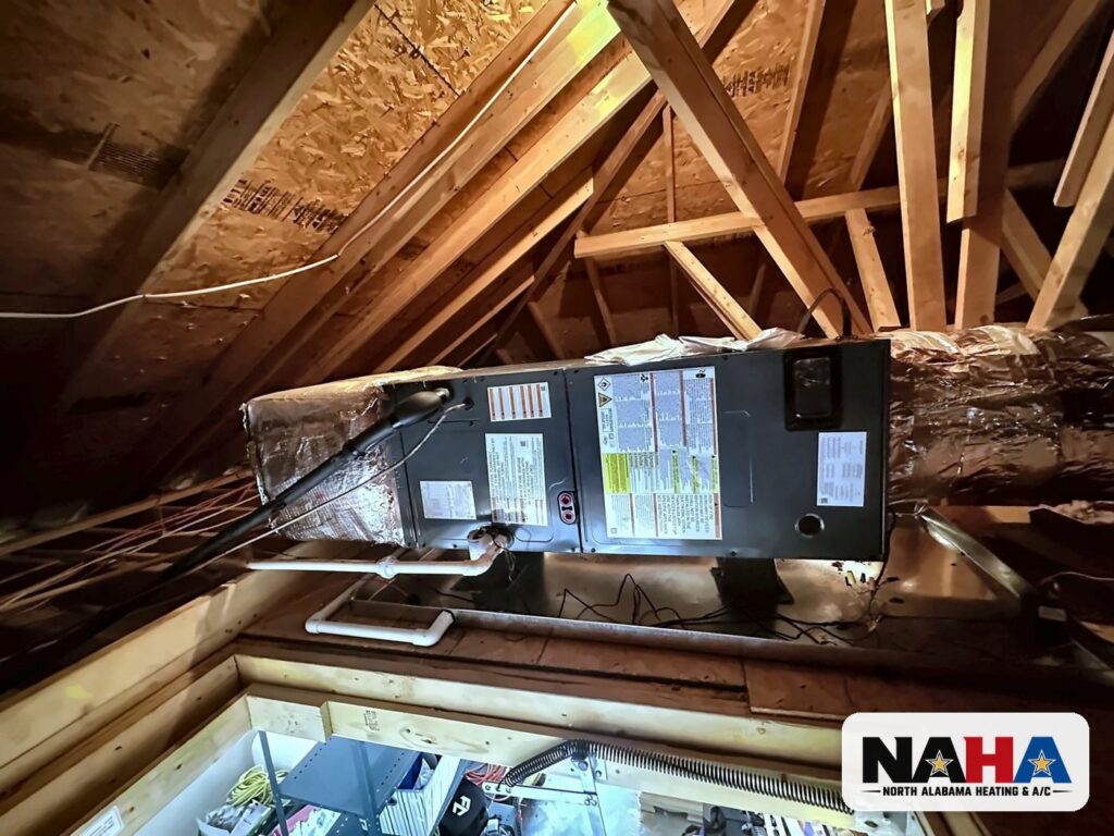 Horizontal air handler installed above an attic access