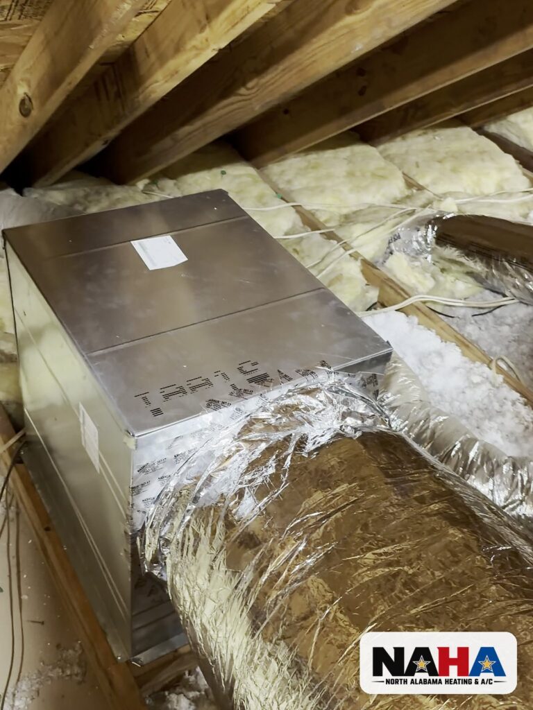 New insulated duct connected to a sheet metal box in an attic