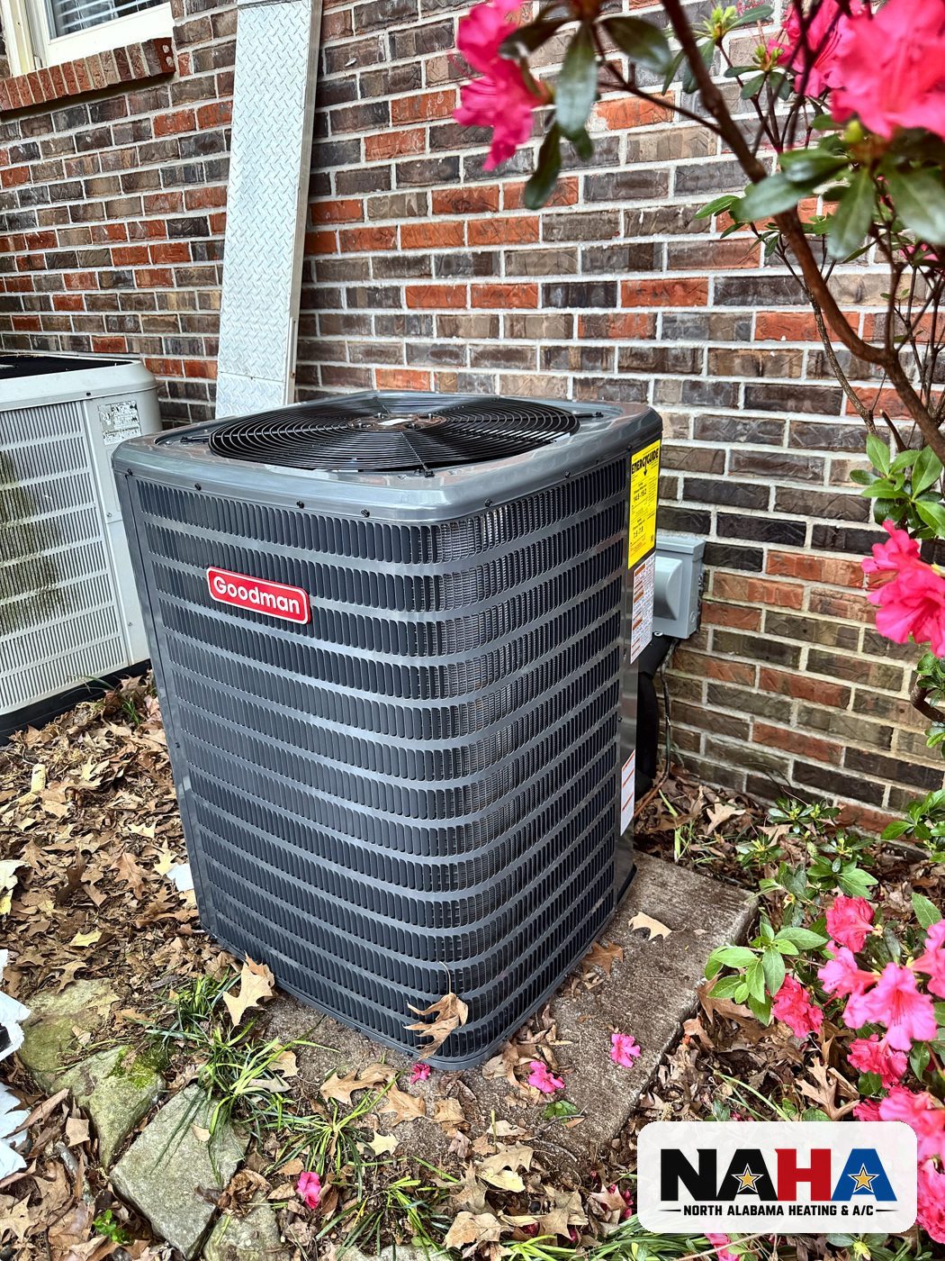 New outdoor unit installed by NAHA beside a brick home in Huntsville