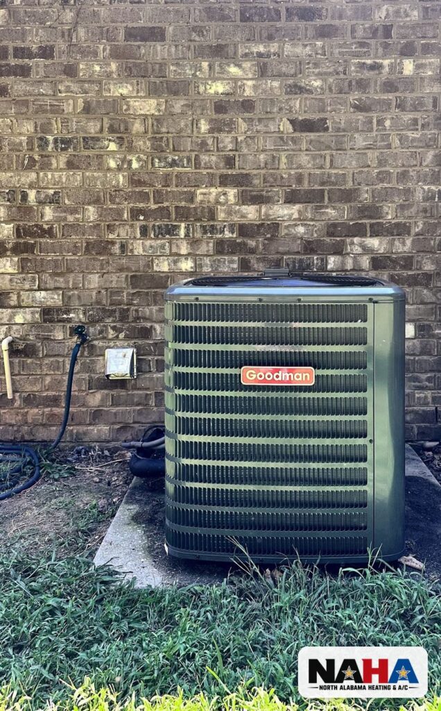 Outdoor condenser beside a brick home