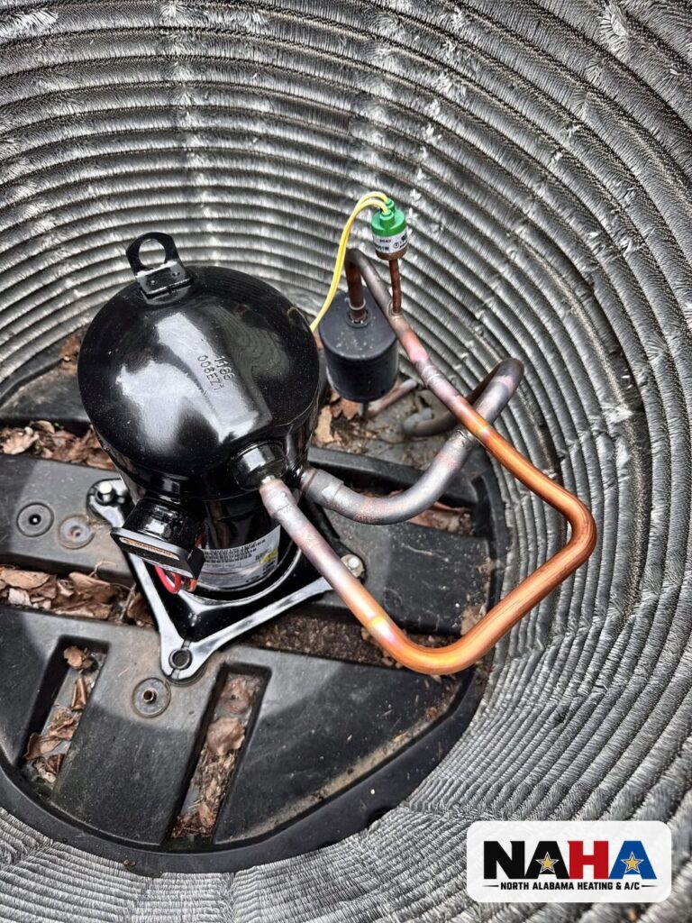 Inside an outdoor unit, compressor view from above