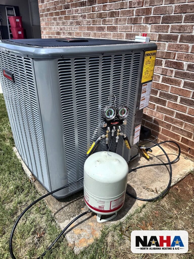 Outdoor unit with refrigerant cylinder and gauges connected